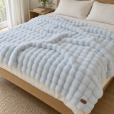 Sky Blue Softhour Stay-In Blanket on a bed